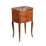 A FRENCH WALNUT AND MARBLE TOPPED PETITE COMMODE IN LOUIS XVI STYLE