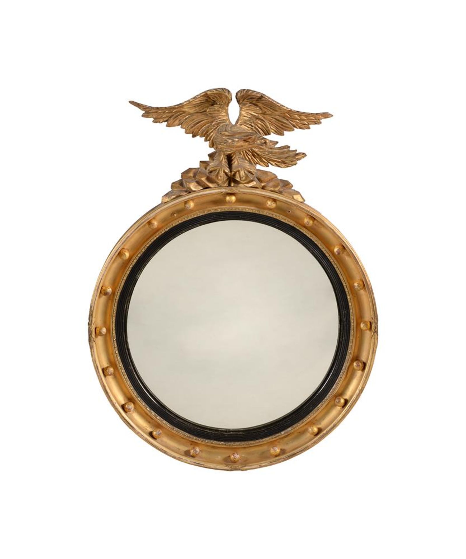 A GILTWOOD AND CONVEX MIRROR IN REGENCY STYLE