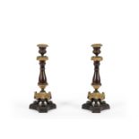 A PAIR OF PATINATED AND GILT METAL CANDLESTICKS IN LOUIS PHILIPPE STYLE