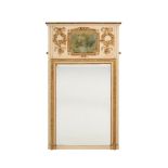 A FRENCH WHITE PAINTED AND PARCEL GILT TRUMEAU WALL MIRROR