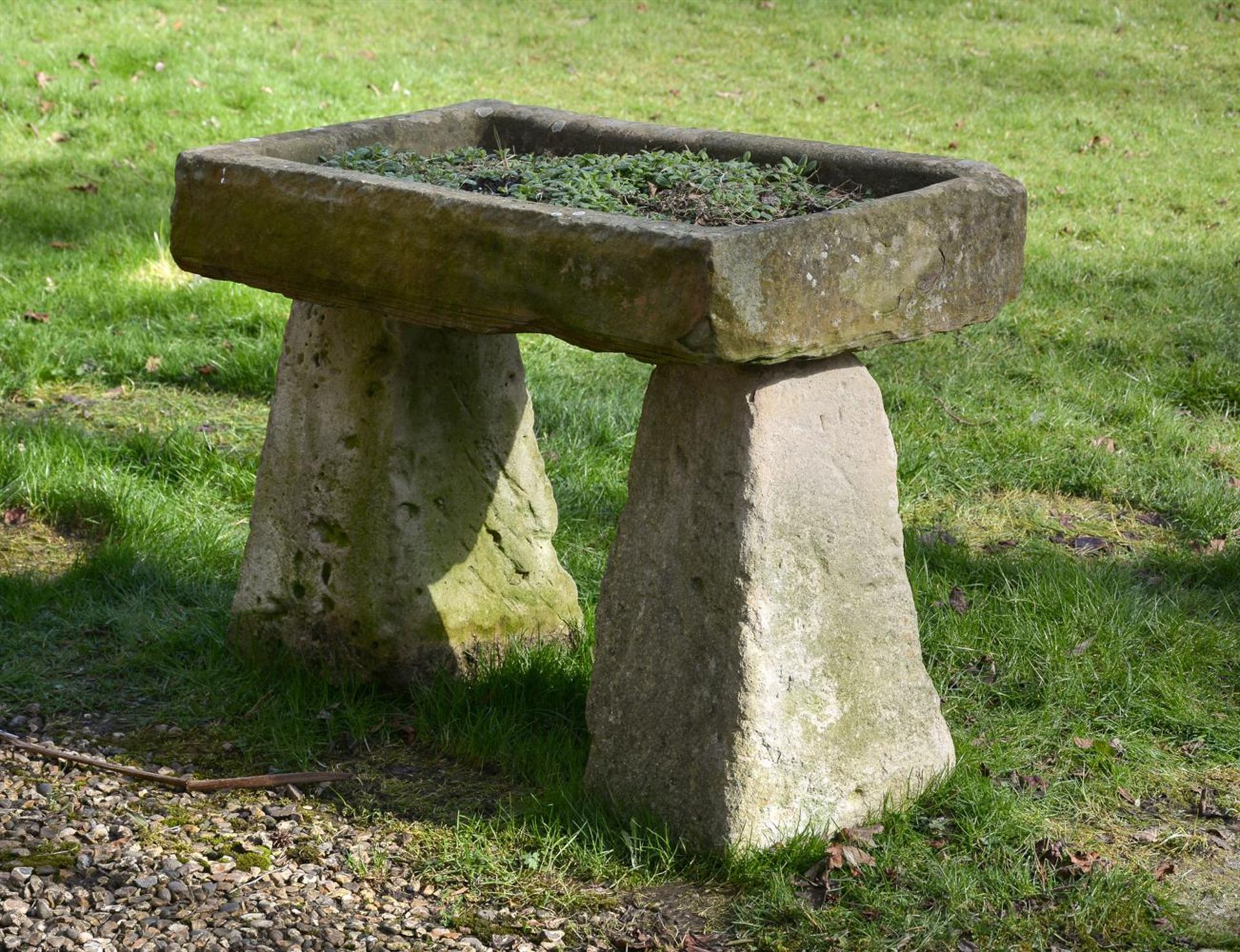 A LIMESTONE RAISED PLANTER OR BIRD BATH