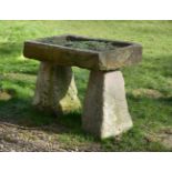 A LIMESTONE RAISED PLANTER OR BIRD BATH