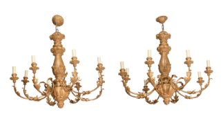 A PAIR OF GILTWOOD AND GILT METAL EIGHT BRANCH CHANDELIERS IN 18TH CENTURY STYLE