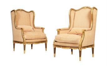 A PAIR OF GILTWOOD AND UPHOLSTERED HIGH BACK ARMCHAIRS