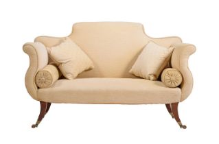 A WALNUT AND UPHOLSTERED SOFA