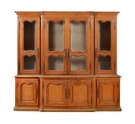 A FRENCH PINE BREAKFRONT BOOKCASE