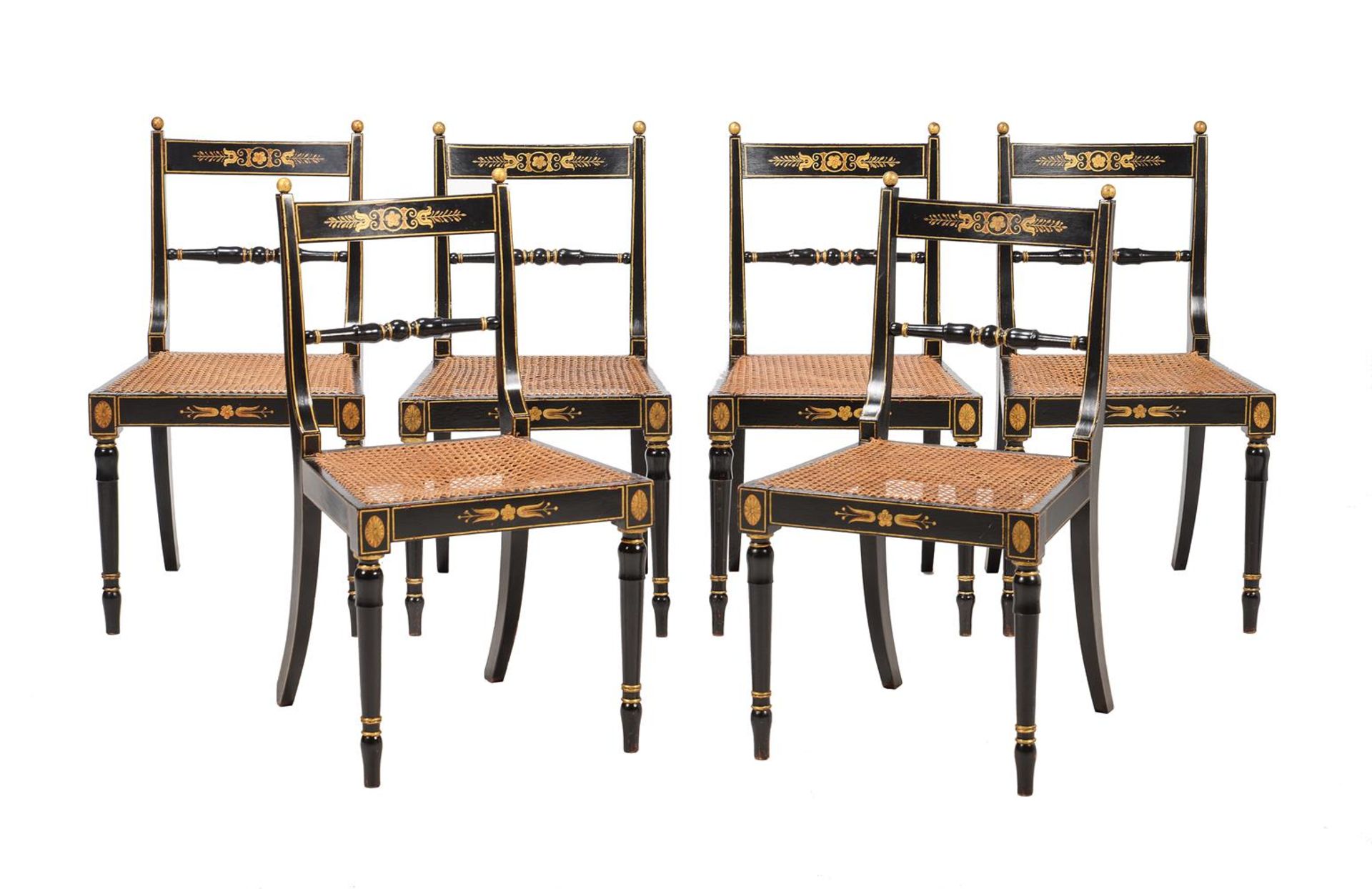 A SET OF SIX REGENCY EBONISED AND PARCEL GILT SIDE CHAIRS