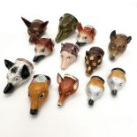 A GROUP OF TWELVE VARIOUS FOX MASK STIRRUP CUPS