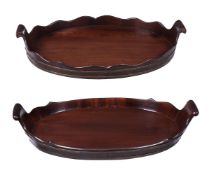 TWO SIMILAR MAHOGANY AND BRASS BOUND TEA TRAYS