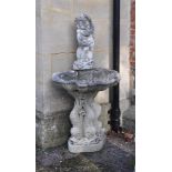 A STONE FIGURAL WALL FOUNTAIN