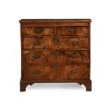 A GEORGE II WALNUT AND ELM CHEST OF DRAWERS