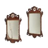 TWO GEORGE II WALNUT AND PARCEL GILT WALL MIRRORS