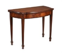 A LATE GEORGE III MAHOGANY BOWFRONT CARD TABLE