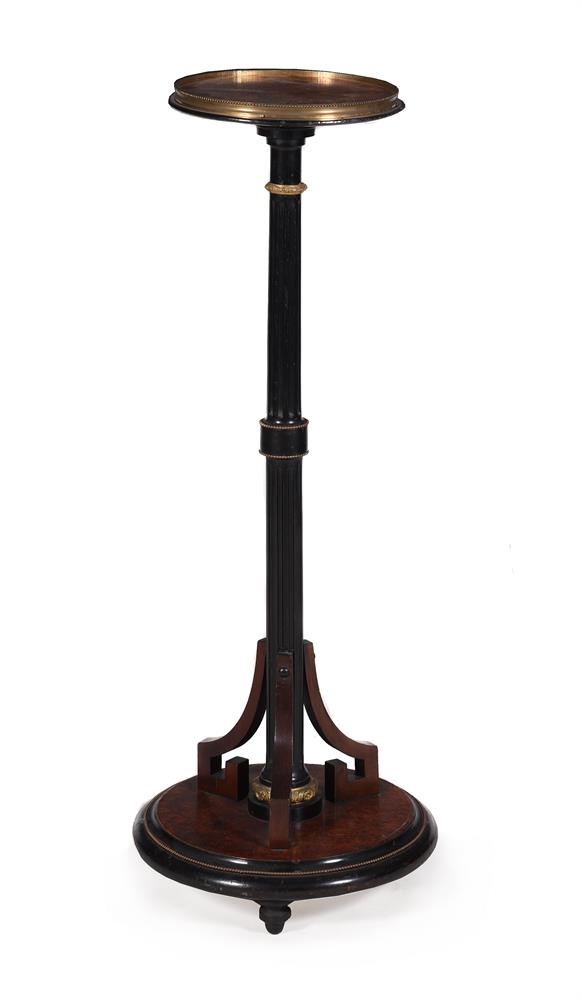 AN AESTHETIC MOVEMENT AMBOYNA AND EBONISED TORCHERE STAND