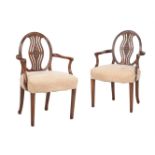 A MATCHED PAIR OF MAHOGANY OPEN ARMCHAIRS IN GEORGE III 'HEPPLEWHITE' TASTE