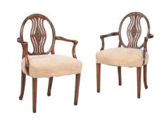A MATCHED PAIR OF MAHOGANY OPEN ARMCHAIRS IN GEORGE III 'HEPPLEWHITE' TASTE