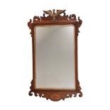 A MAHOGANY AND PARCEL GILT FRET FRAME WALL MIRRORIN GEORGE II STYLE