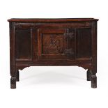 A CARVED OAK COFFER