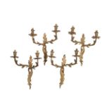 A SET OF FOUR GILT METAL TWIN ARM WALL APPLIQUES IN LOUIS XV STYLE