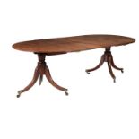 A MAHOGANY DINING TABLE