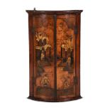 A BLACK JAPANNED BOWFRONT HANGING CORNER CABINET