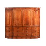 A LARGE MAHOGANY BREAKFRONT WARDROBE