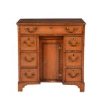 A SATINWOOD KNEEHOLE DESK