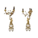 A PAIR OF FRENCH ORMOLU AND WHITE MARBLE THREE-LIGHT CANDELABRA, IN LOUIS XVI STYLE