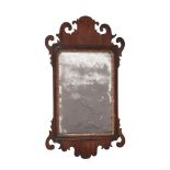 A GEORGE III MAHOGANY WALL MIRROR