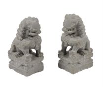 A PAIR OF CARVED STONE GARDEN ORNAMENTS