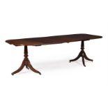 A MAHOGANY DINING TABLE IN REGENCY STYLE