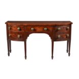 A GEORGE III MAHOGANY AND LINE INLAID BREAKFRONT SIDEBOARD