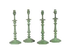 TWO PAIRS OF SIMILAR VERDIGRIS PATINATED METAL CANDLESTICKS