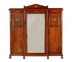 A FRENCH MAHOGANY AND GILT METAL MOUNTED WARDROBE IN EMPIRE STYLE