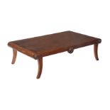 A MAHOGANY LOW CENTRE TABLE IN REGENCY STYLE