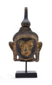 A BURMESE LACQUER HEAD OF BUDDHA20TH CENTURYwith inlaid coloured glass details