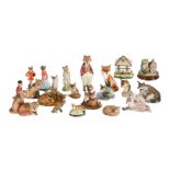 AN ASSORTMENT OF POTTERY AND PORCELAIN MODELS OF FOXES