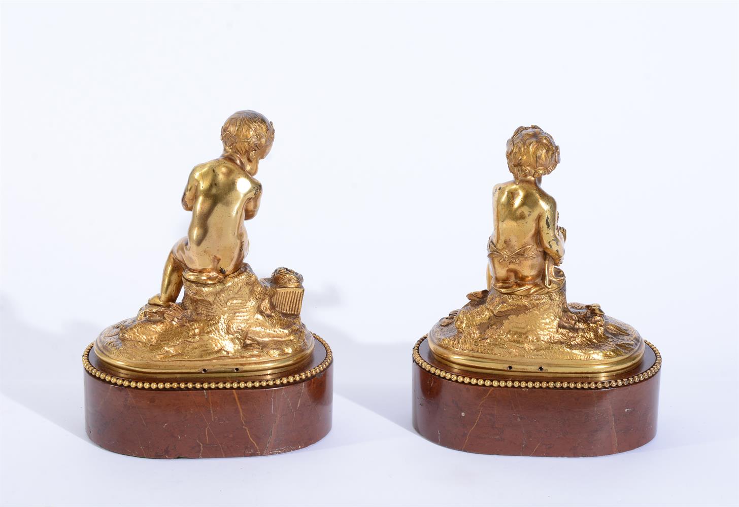 A PAIR OF GILT BRONZE MODELS OF PUTTI - Image 2 of 2