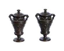 A PAIR OF BRONZE MODELS OF URNS AND COVERS