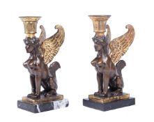 A PAIR OF EGYPTIAN REVIVAL CANDLESTICKS IN EMPIRE STYLE