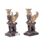 A PAIR OF EGYPTIAN REVIVAL CANDLESTICKS IN EMPIRE STYLE