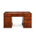 A VICTORIAN MAHOGANY PARTNER'S DESK IN GEORGE III STYLE