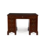 A GEORGE III MAHOGANY FREESTANDING PEDESTAL DESK