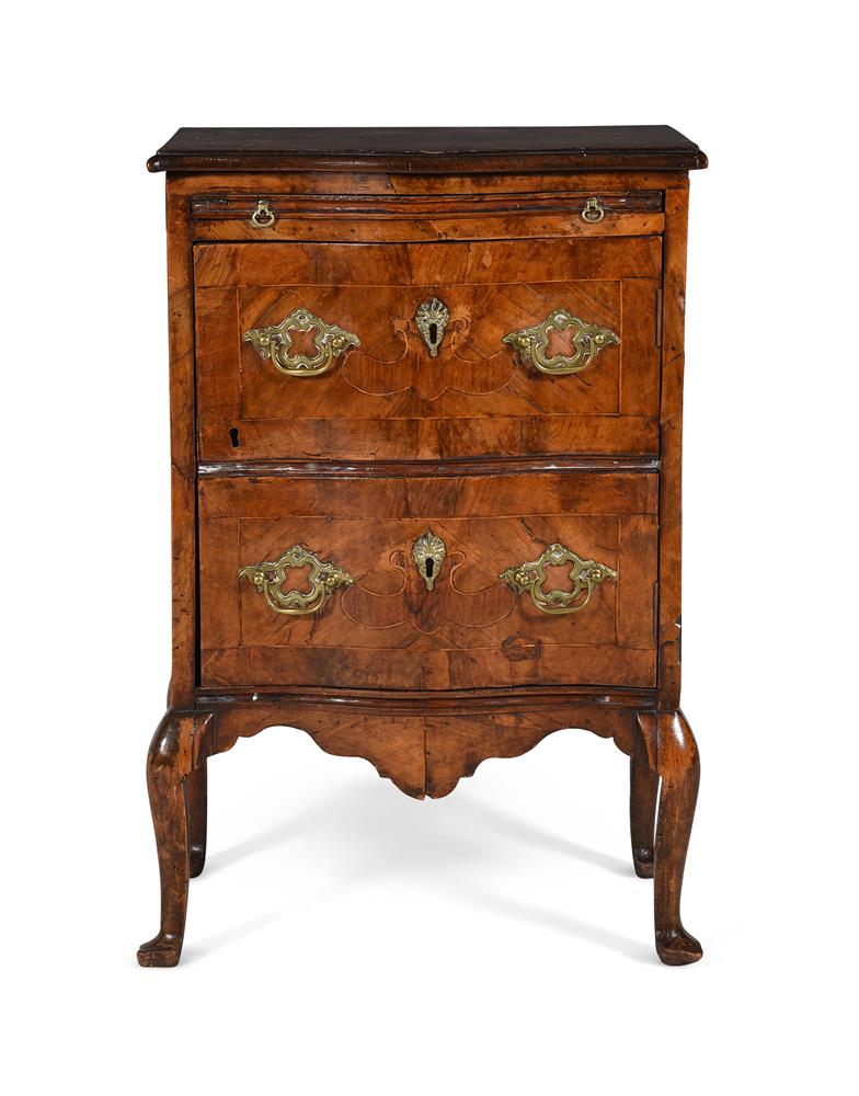 A WALNUT SERPENTINE CHEST OR COMMODE