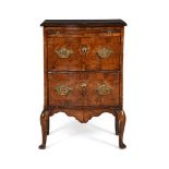 A WALNUT SERPENTINE CHEST OR COMMODE