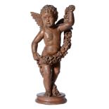 A COLD PAINTED TERRACOTTA MODEL OF A PUTTO