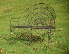 A BLACK PAINTED WIREWORK BENCH IN VICTORIAN STYLE