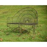 A BLACK PAINTED WIREWORK BENCH IN VICTORIAN STYLE