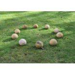 A SET OF TEN STONE GARDEN SPHERES OR LAWN MARKERS