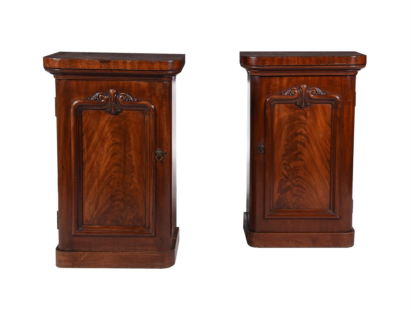 A PAIR OF MAHOGANY PEDESTAL CUPBOARDS